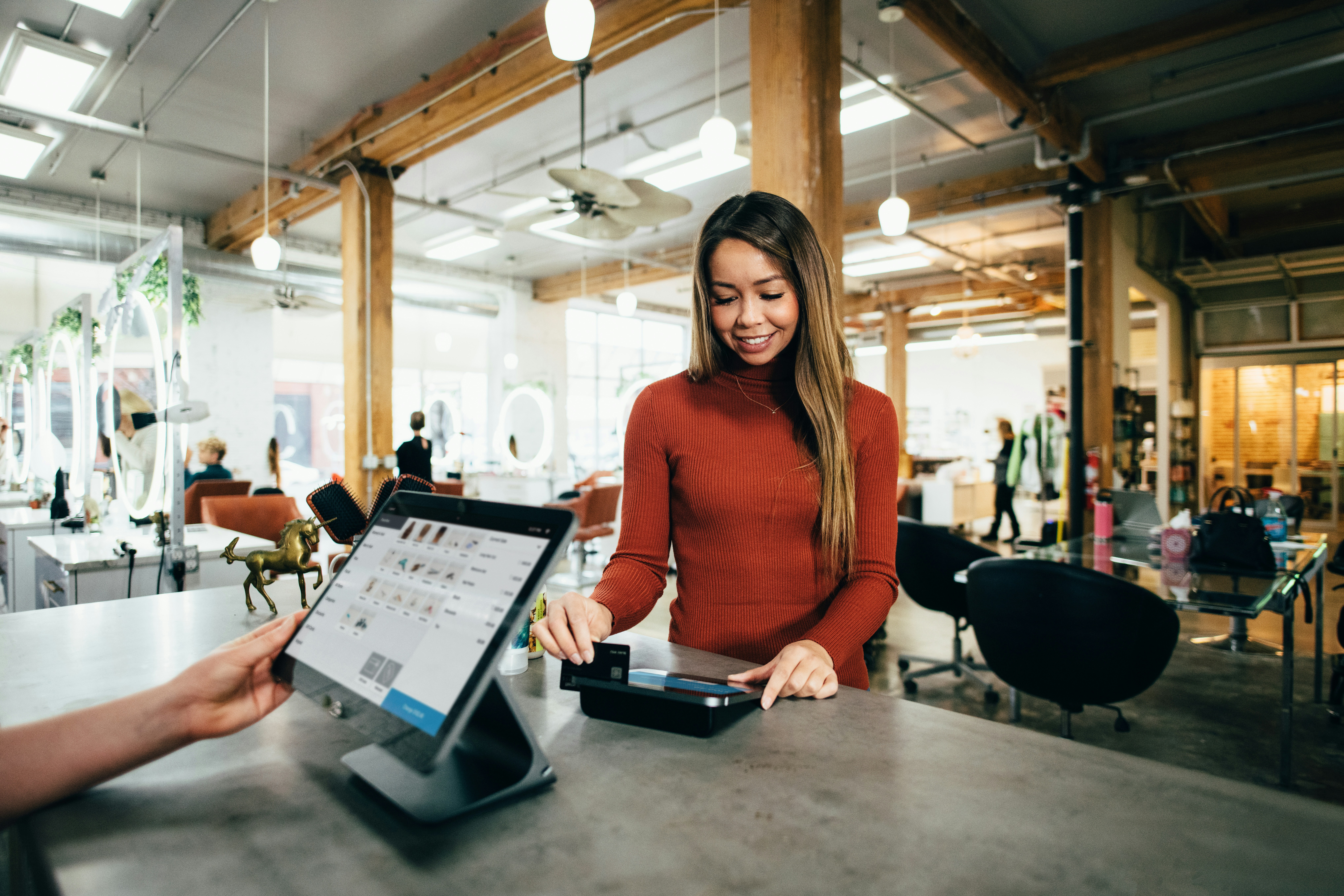 Woman using a credit card to make a purchase